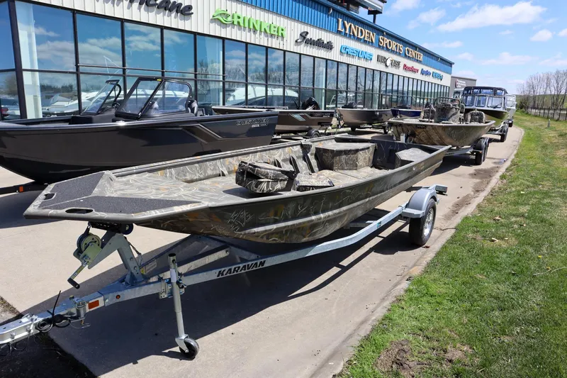 Slide: The Image of 2024 War Eagle 754LDV Sportsman boat with Mercury 40 outboard motor on trailer. - 3