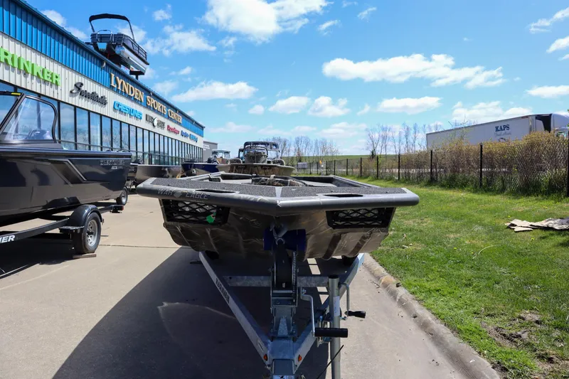 Slide: The Image of 2024 War Eagle 754LDV Sportsman boat on trailer, parked outdoors. - 4