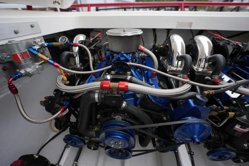 Slide: The Image of 1999 Fountain 35 Lightning engine compartment with blue and chrome components. - 11