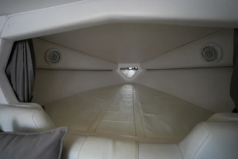 Slide: The Image of Interior cabin of a 1999 Fountain 35 Lightning boat with white upholstery. - 18