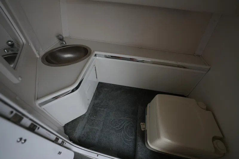 Slide: The Image of 1999 Fountain 35 Lightning boat bathroom with sink and toilet - 26