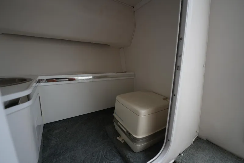 Slide: The Image of 1999 Fountain 35 Lightning boat interior with portable toilet. - 28