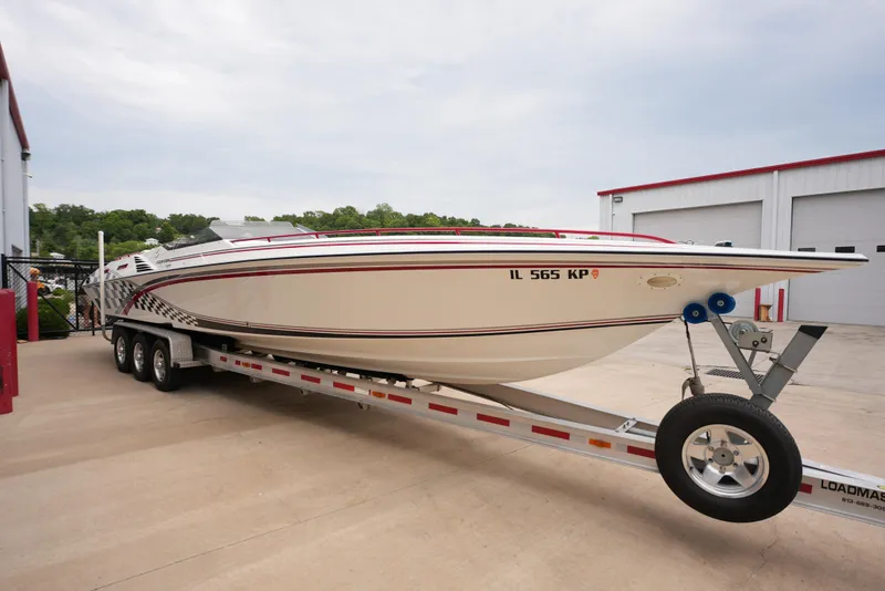 Slide: The Image of 1999 Fountain 35 Lightning boat on a trailer outside a storage facility. - 3