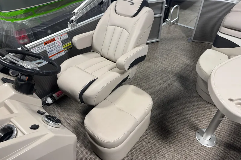 Slide: The Image of 2019 Bennington SX 21 Cruise boat interior with captain's chair and steering wheel. - 31