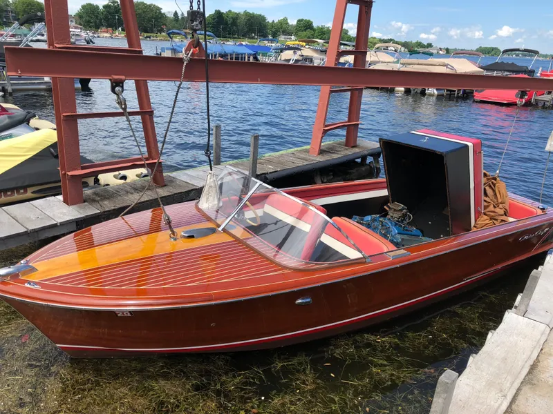 Slide: The Image of 1959 Chris-Craft 18 Continental wooden boat docked at a marina. - 4