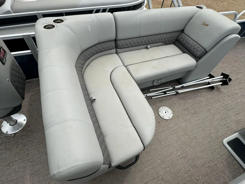 Slide: The Image of 2019 Ranger Reata 200F boat with gray cushioned seating and cup holders. - 11
