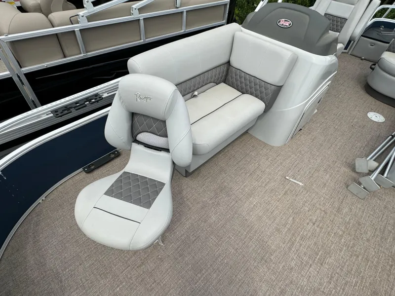 Slide: The Image of 2019 Ranger Reata 200F boat interior with gray seating and carpeted floor. - 6