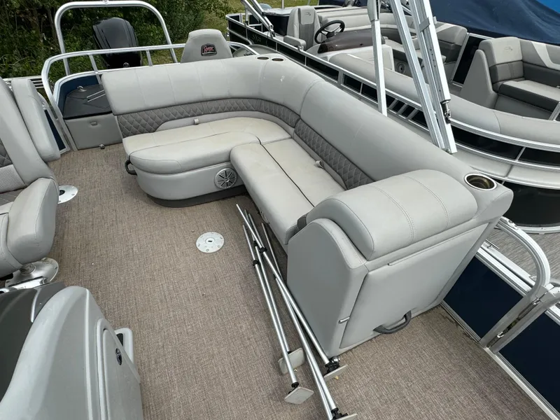 Slide: The Image of 2019 Ranger Reata 200F pontoon boat with spacious seating and beige upholstery. - 7