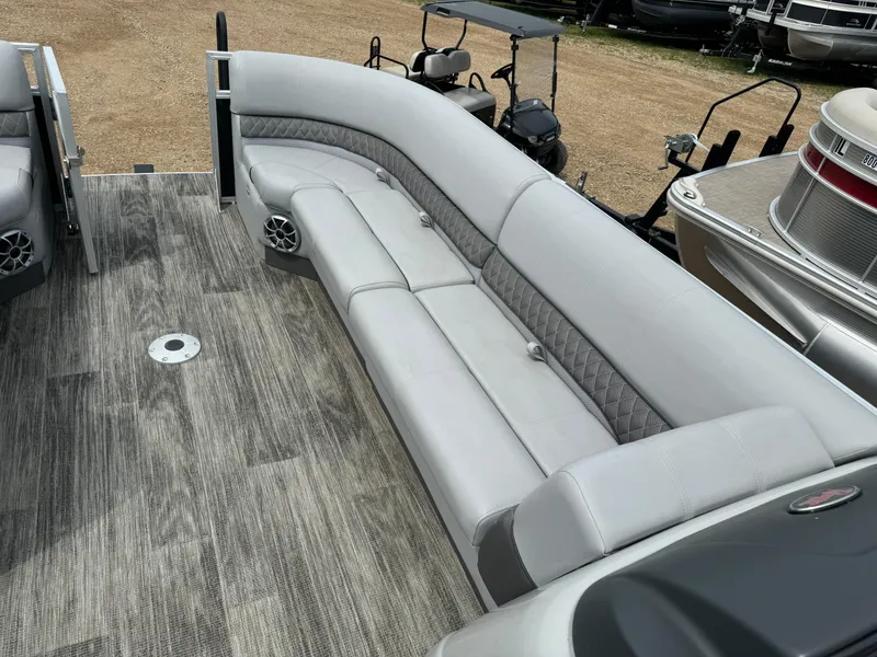 Slide: The Image of 2024 Ranger Reata 220C pontoon boat with spacious seating and modern design. - 17