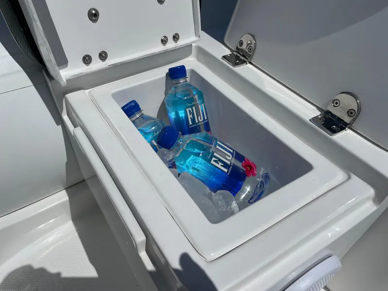 Slide: The Image of Built-in cooler with Fiji water bottles on Walker Bay Venture 13, 2025 model. - 10