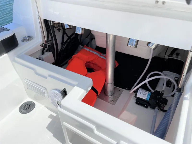 Slide: The Image of Storage compartment of 2025 Walker Bay Venture 13 boat with life jacket. - 11