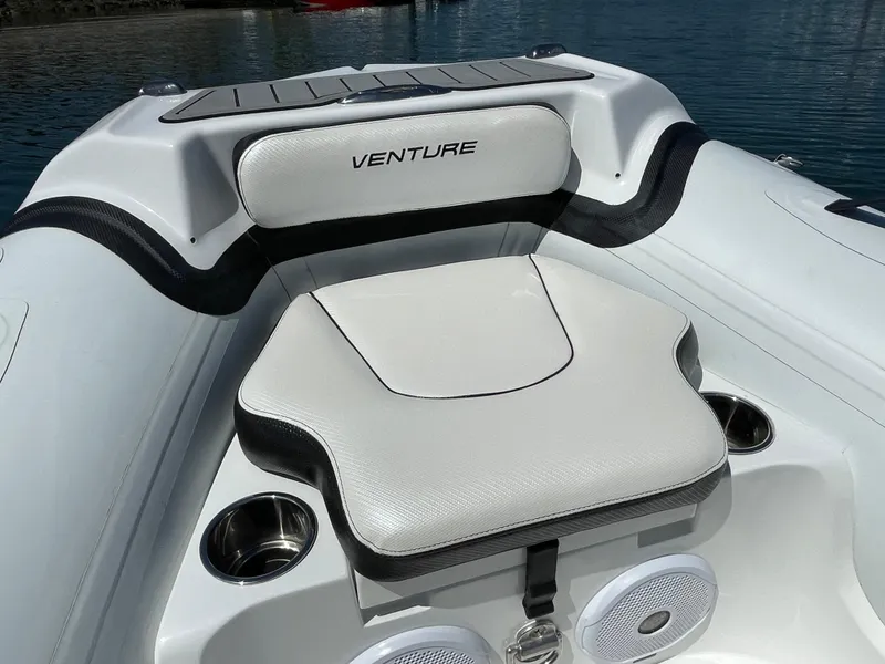 Slide: The Image of Walker Bay Venture 13 boat seat, 2025 model, with cup holders and speakers. - 5