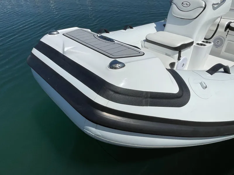 Slide: The Image of Walker Bay Venture 13 (2025) boat bow in water, close-up view. - 6