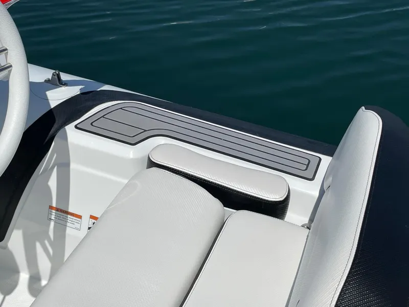 Slide: The Image of Close-up of the 2025 Walker Bay Venture 13 boat's seating and console. - 7