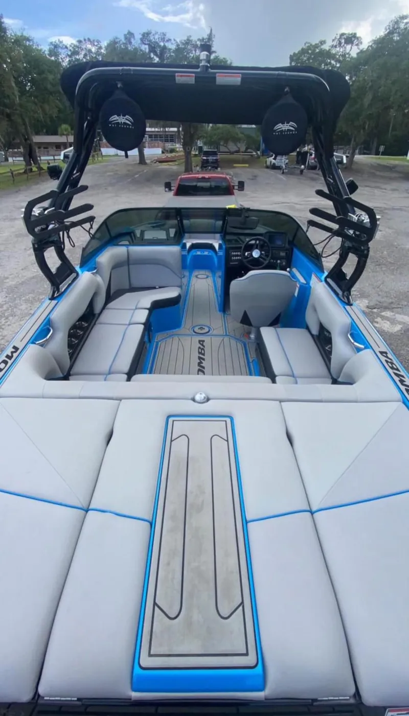 Slide: The Image of 2019 Moomba Craz boat interior with blue and gray seating and advanced sound system. - 8