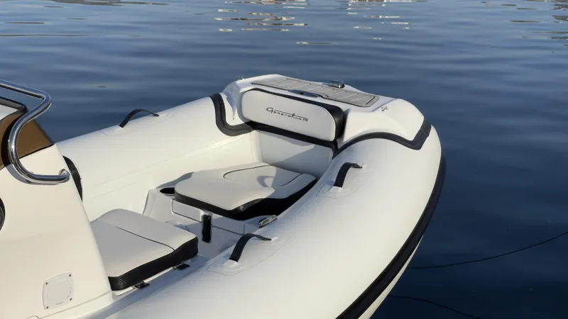 Slide: The Image of 2025 Walker Bay Generation 13 LTE boat on calm water. - 4