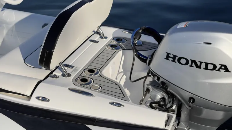 Slide: The Image of 2025 Walker Bay Generation 13 LTE boat with Honda outboard motor. - 5
