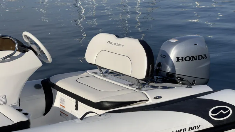 Slide: The Image of Walker Bay Generation 13 LTE 2025 boat with Honda outboard motor on water. - 6