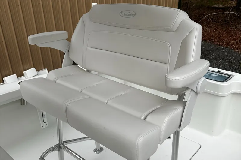 Slide: The Image of Pair Customs 21DV 2024 boat seat with white leather upholstery and armrests. - 3