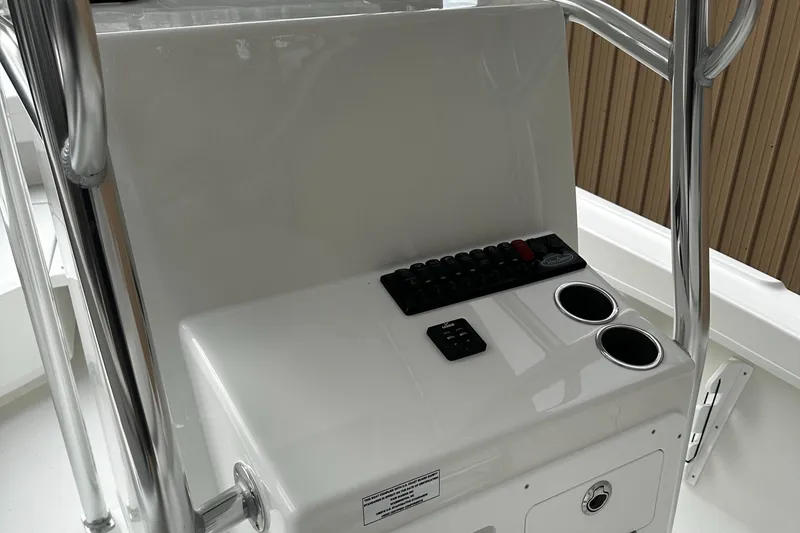 Slide: The Image of Control console of 2024 Pair Customs 21DV boat with cup holders and switches. - 5
