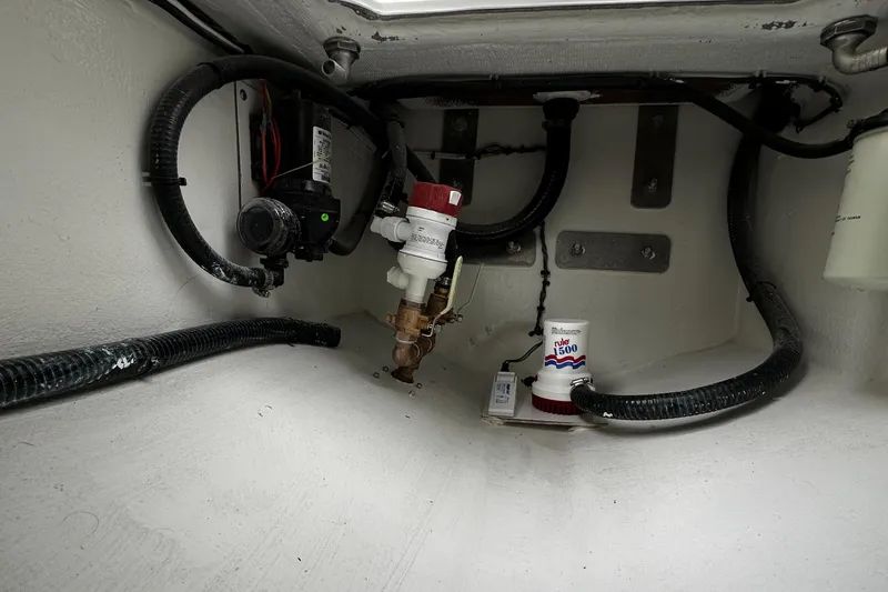 Slide: The Image of 2024 Pair Customs 21DV boat interior wiring and plumbing system. - 8