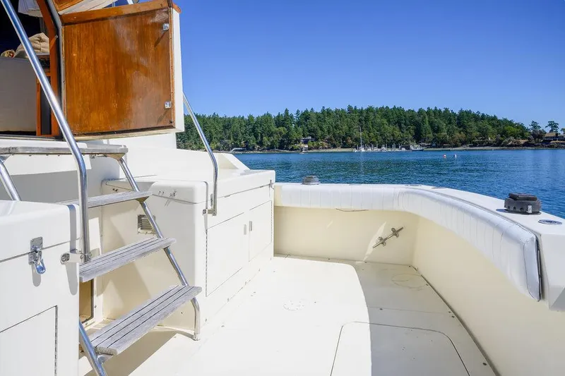 Slide: The Image of 1987 Hatteras 72 Flush Deck Cockpit Motor Yacht, spacious deck with scenic water view. - 20