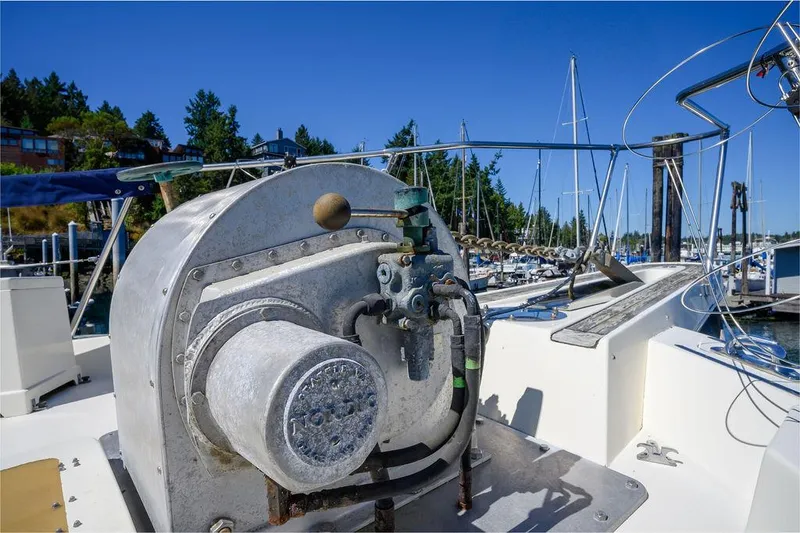 Slide: The Image of 1987 Hatteras 72 Flush Deck Cockpit Motor Yacht at marina, featuring deck equipment. - 23