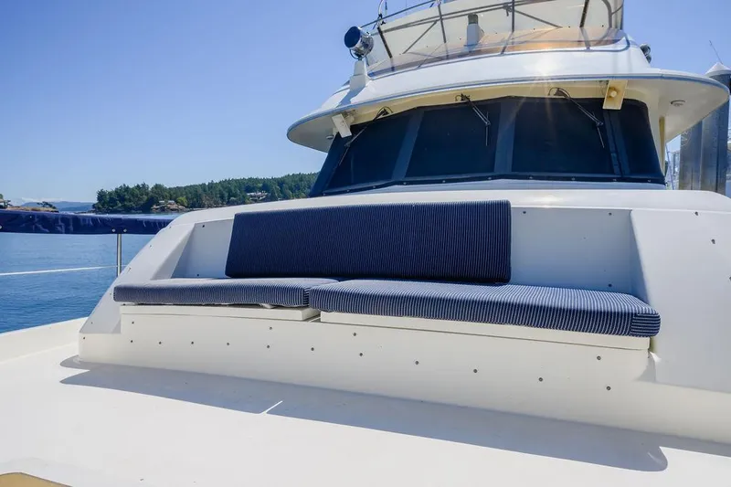 Slide: The Image of 1987 Hatteras 72 Flush Deck Cockpit Motor Yacht with striped seating on deck. - 27
