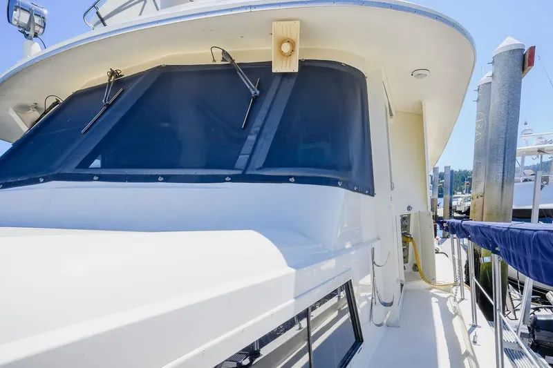 Slide: The Image of 1987 Hatteras 72 Flush Deck Cockpit Motor Yacht, exterior view at dock. - 28