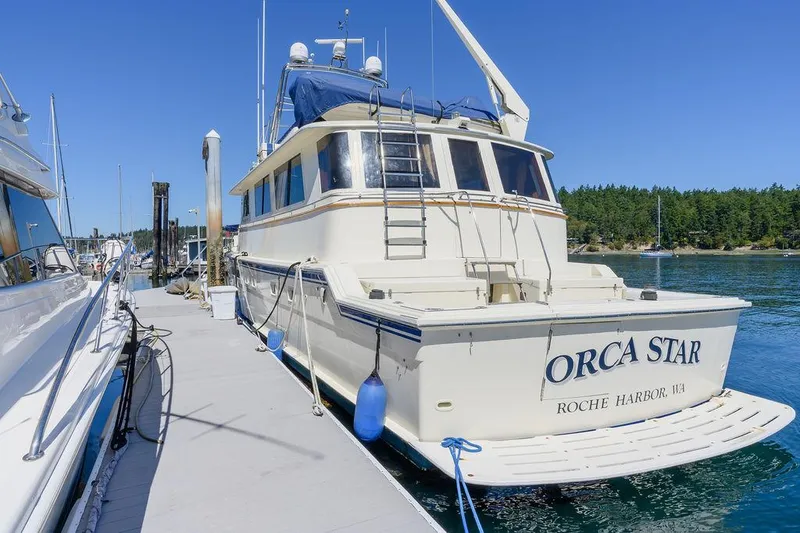Slide: The Image of 1987 Hatteras 72 Flush Deck Cockpit Motor Yacht docked at Roche Harbor. - 9