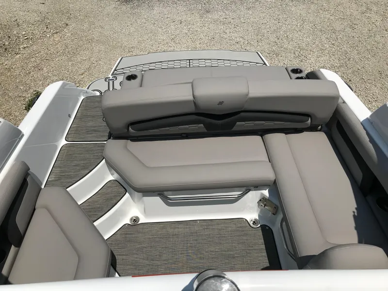 Slide: The Image of 2025 Four Winns HD3 boat with spacious, cushioned seating area. - 11