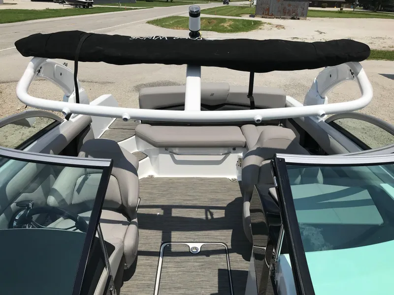 Slide: The Image of 2025 Four Winns HD3 boat interior with seating and windshield. - 12