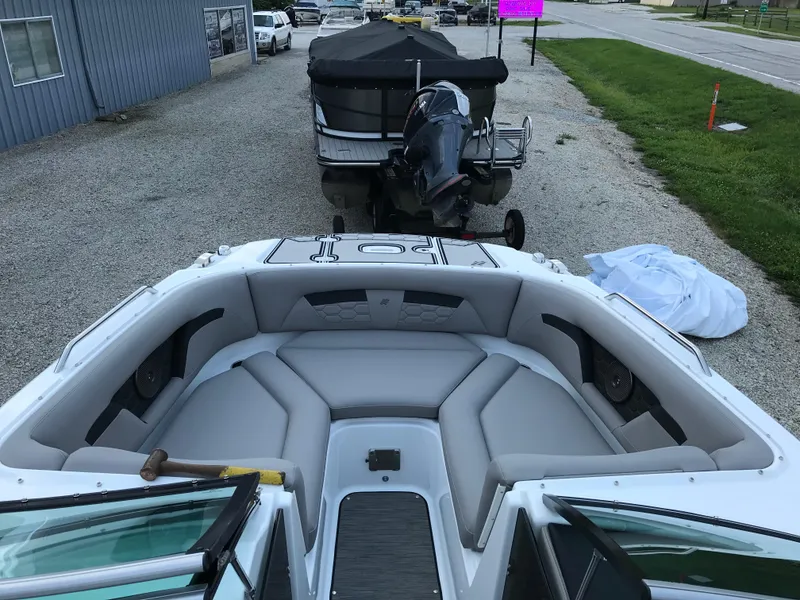 Slide: The Image of 2025 Four Winns HD3 boat with spacious seating and modern design. - 6