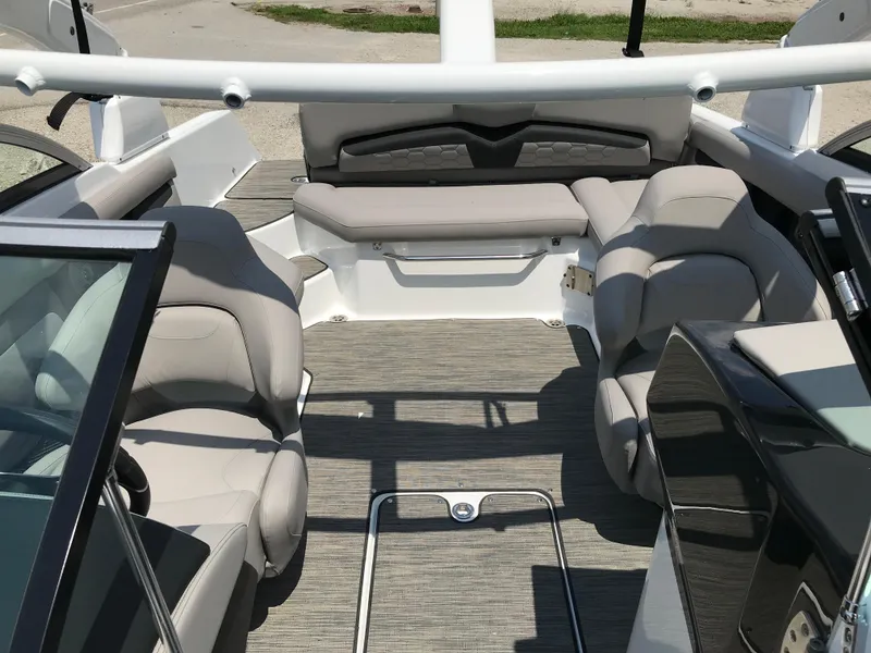 Slide: The Image of Interior of 2025 Four Winns HD3 boat with beige seating and modern design. - 9