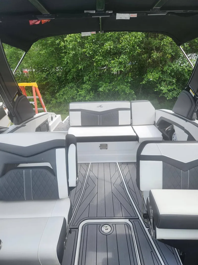 Slide: The Image of 2022 Monterey 278SS boat interior with modern seating and sleek flooring design. - 10