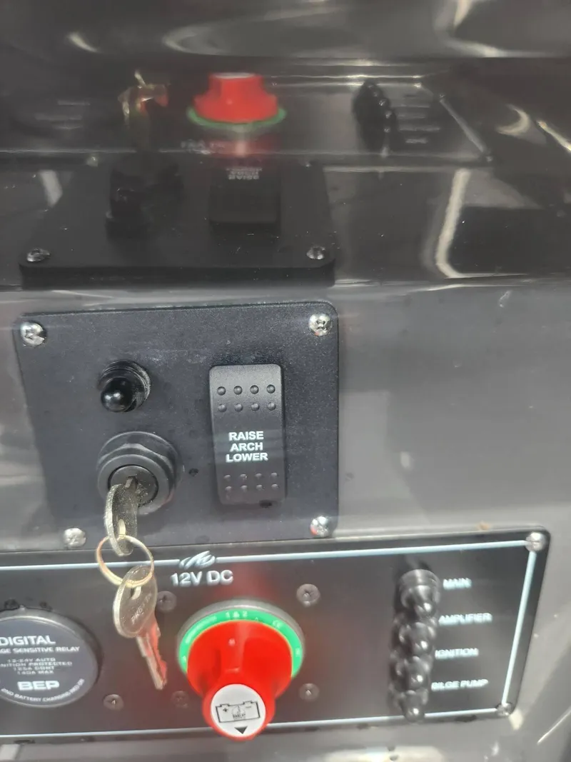 Slide: The Image of Control panel of a 2022 Monterey 278SS boat with ignition keys and switches. - 12