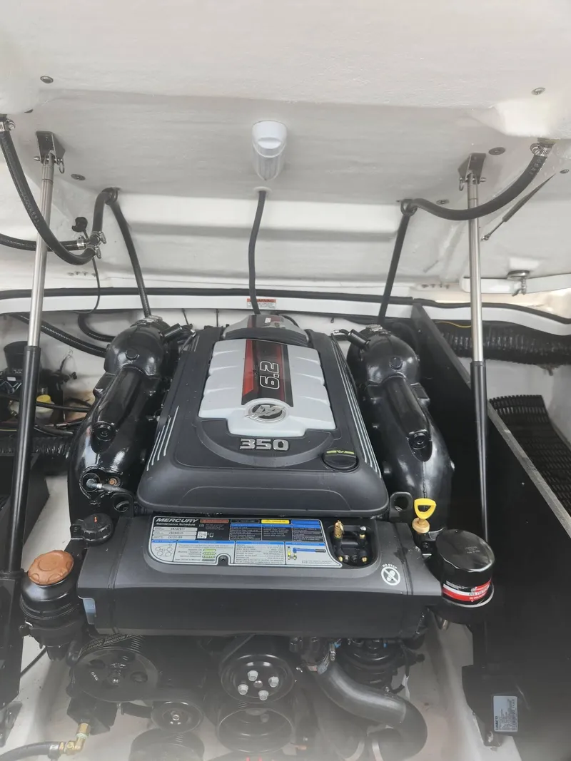 Slide: The Image of 2022 Monterey 278SS boat engine compartment with Mercury 350 engine. - 16