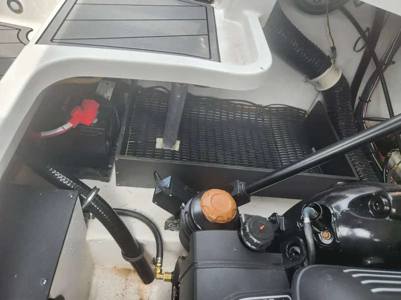 Slide: The Image of 2022 Monterey 278SS boat engine compartment with battery and wiring. - 18