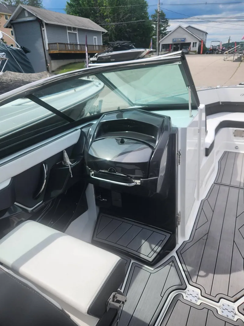 Slide: The Image of 2022 Monterey 278SS boat interior with modern dashboard and seating. - 19