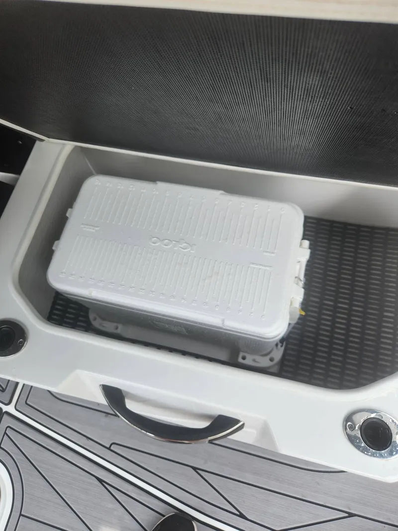 Slide: The Image of Storage compartment with cooler in 2022 Monterey 278SS boat. - 21