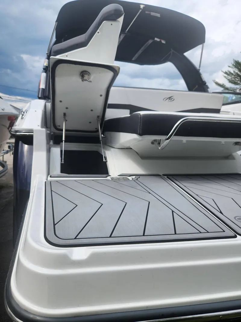 Slide: The Image of 2022 Monterey 278SS boat with swim platform and seating area. - 26