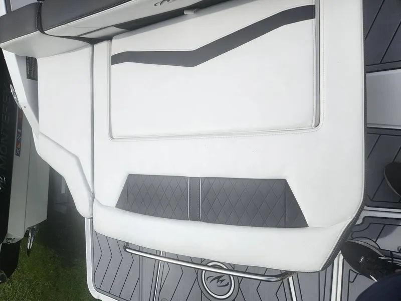 Slide: The Image of 2022 Monterey 278SS boat interior with white and black seating. - 4