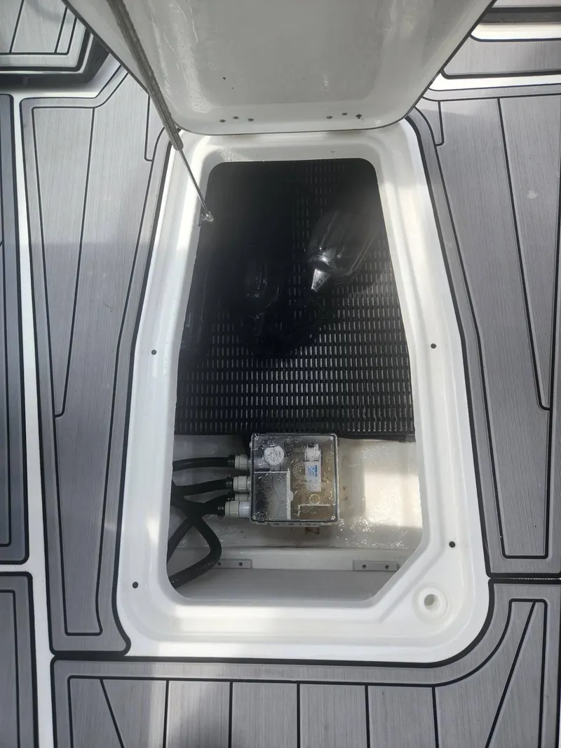 Slide: The Image of Open storage compartment on a 2022 Monterey 278SS boat deck. - 7