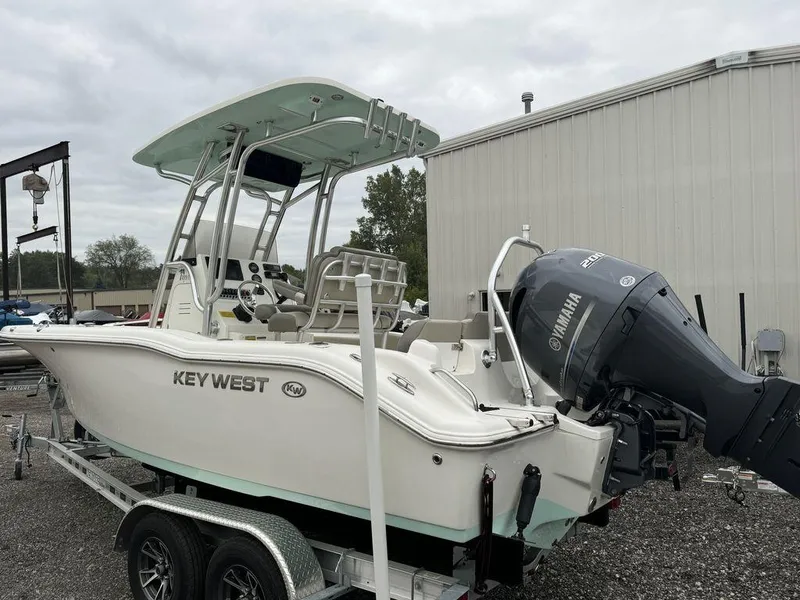 Slide: The Image of 2023 Key West 219 FS boat with Yamaha engine on trailer. - 2