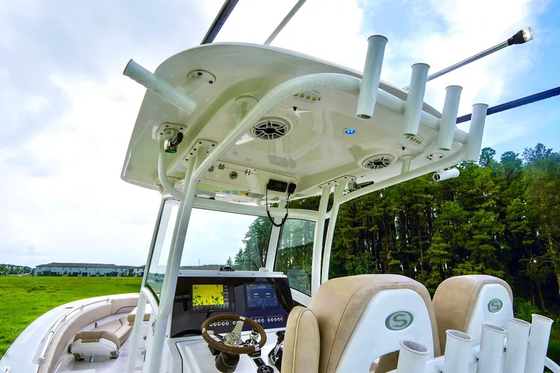 Slide: The Image of 2019 Sportsman Open 282 Center Console boat interior with advanced navigation system. - 12