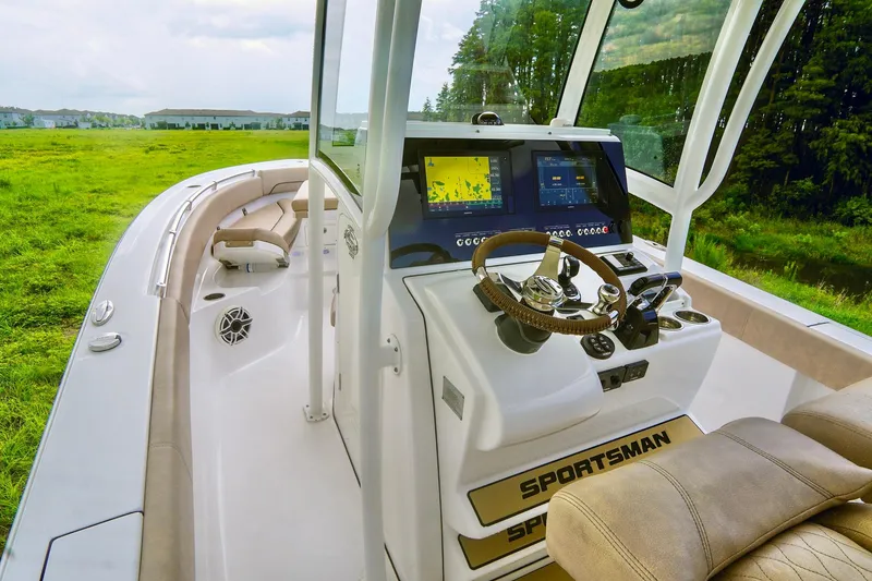 Slide: The Image of 2019 Sportsman Open 282 Center Console boat interior with advanced navigation system. - 14