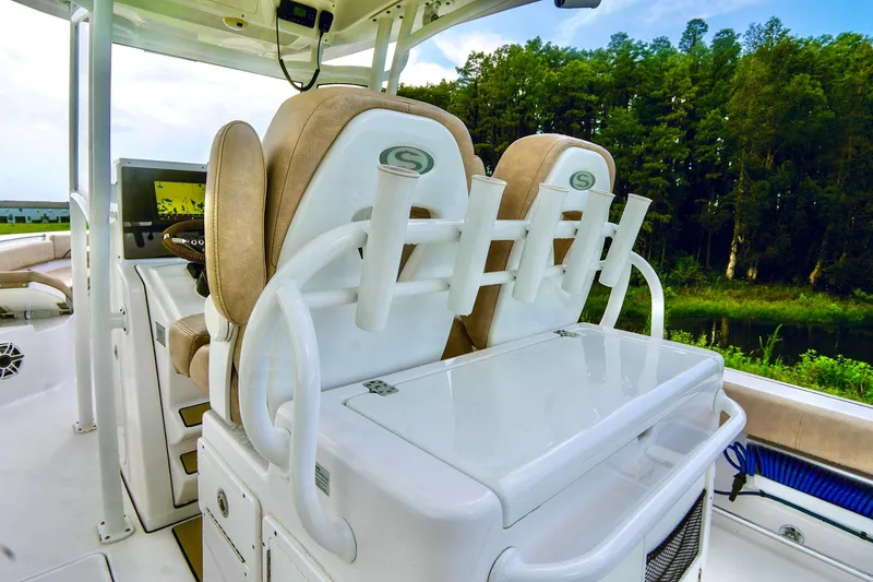 Slide: The Image of 2019 Sportsman Open 282 Center Console boat with dual seats and rod holders. - 17