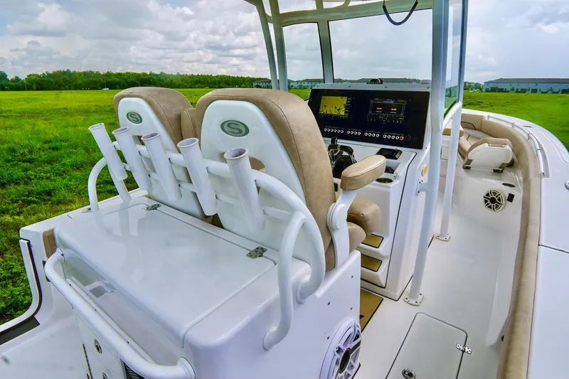 Slide: The Image of 2019 Sportsman Open 282 Center Console boat interior with helm and seating. - 18