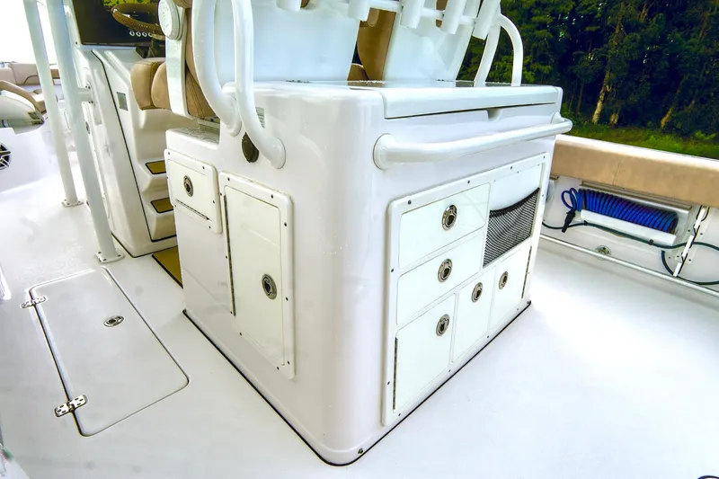 Slide: The Image of 2019 Sportsman Open 282 Center Console boat interior with storage compartments. - 20