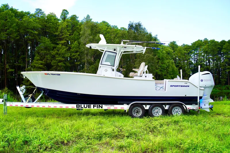 Slide: The Image of 2019 Sportsman Open 282 Center Console boat on a Blue Fin trailer. - 30
